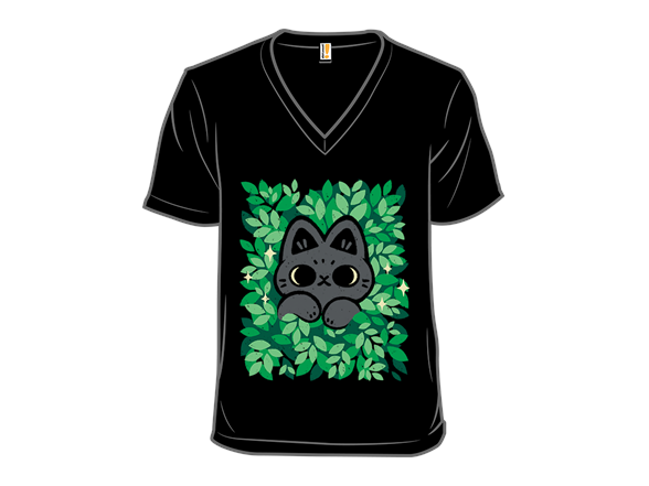 Cute Black Cat Peeking Through Green Leaves