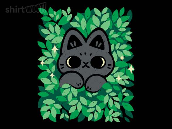 Cute Black Cat Peeking Through Green Leaves
