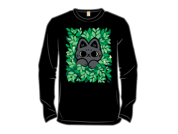 Cute Black Cat Peeking Through Green Leaves